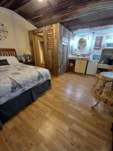 a bedroom with a bed and a table in a room at Acorn Hideaways Canton Sweet Dreams for 2 in Canton