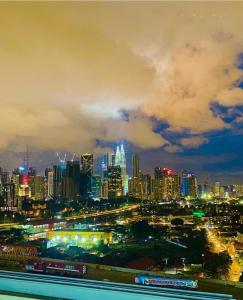 a view of a city at night with at Datum Jelatek Sky Residence KLCC SkyRing Linked to LRT and Mall in Kuala Lumpur