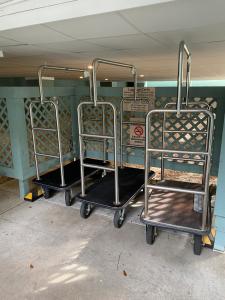 two luggage carts are sitting on a bus at Vacation Bliss LLC in Hilton Head Island