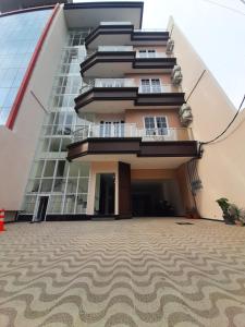 a building with a carpet in front of it at Kawa Living in Krukah