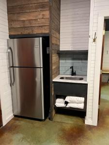 a kitchen with a stainless steel refrigerator and a sink at Hideout on the Horseshoe in Canyon Lake