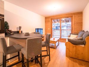 a kitchen and living room with a table and chairs at Appartement Valmorel, 2 pièces, 4 personnes - FR-1-356-412 in Valmorel