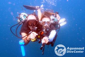 two people in the water with diving equipment at Bangka Hostels in El Nido