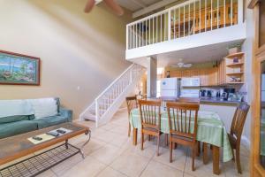 a living room with a couch and a table at Paniolo Condo in Kahuku