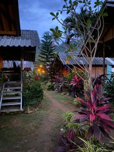 a dirt road in front of a house at Blue Sky Resort in Ko Chang