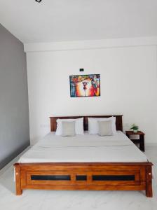 Postel nebo postele na pokoji v ubytování kandy hill villa