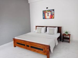 Postel nebo postele na pokoji v ubytování kandy hill villa