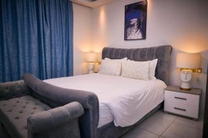 Postel nebo postele na pokoji v ubytování RESIDENCE NOUMSI