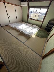 Letto o letti in una camera di SUN庭園