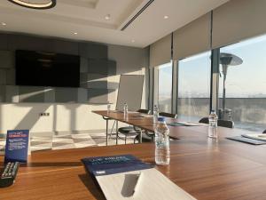 a conference room with two bottles of water on a table at Holiday Inn Express - Ankara - Airport by IHG in Ankara