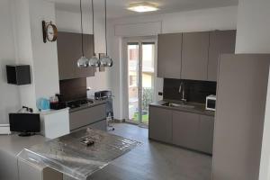 a large kitchen with a counter top in a room at Barzo Apartment in Rome