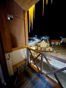a view from the balcony of a building at night at Bakuriani MIX 401G in Bakuriani