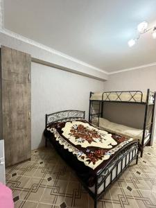 a bedroom with a bed in a room at Bakuriani MIX 401G in Bakuriani