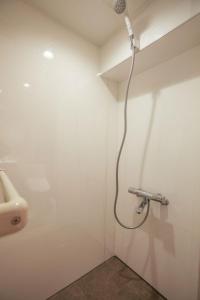 a shower in a bathroom with a sink at ZDT-304 in Tokyo