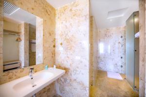 a bathroom with a sink and a mirror at Zen Resort Sahl Hasheesh by TBH Hotels in Hurghada