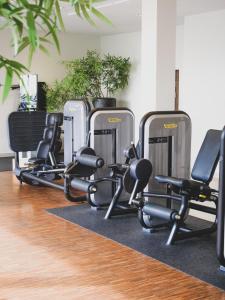 a row of exercise equipment in a gym at Clarion Hotel Arlanda Airport Terminal in Arlanda