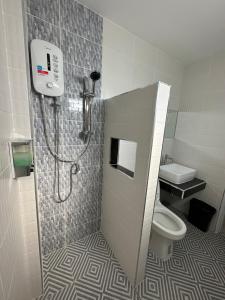 a bathroom with a shower and a toilet at Better Life Residence Phuket in Nai Yang Beach