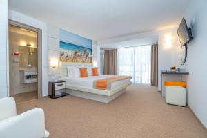 Postel nebo postele na pokoji v ubytování Mera Resort