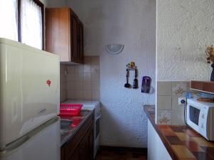 Kuchyň nebo kuchyňský kout v ubytování Sant Ambroggio