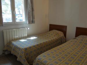 Postel nebo postele na pokoji v ubytování Sant Ambroggio