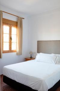 Postel nebo postele na pokoji v ubytování Hotel Tugasa El Almendral
