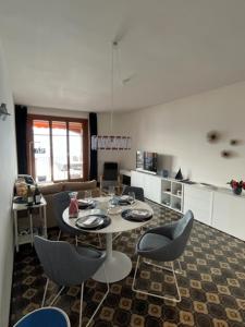 a kitchen with a table and chairs in a room at Lavinia in Oggebbio