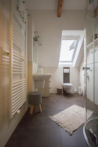 a bathroom with a sink and a toilet and a window at Gästehaus Dworschak in Leutschach