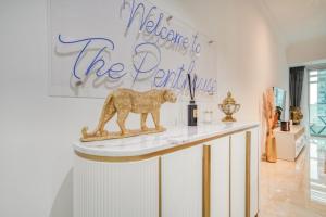 a sign that says welcome to the panticking on a counter at The Marina PENTHOUSE near JBR 46th Floor in Dubai +58 photos