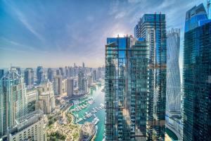 a view of a city with a river and buildings at The Marina PENTHOUSE near JBR 46th Floor in Dubai