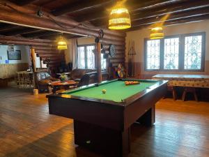 a living room with a pool table in it at Chata Vrch Varta in Ružomberok