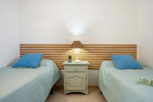 A bed or beds in a room at Mare Internum