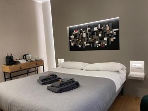 Postel nebo postele na pokoji v ubytování LUCRINO 45 by Ale