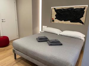 Postel nebo postele na pokoji v ubytování LUCRINO 45 by Ale