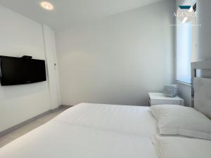 Łóżko lub łóżka w pokoju w obiekcie Appartement New Green