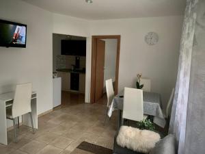 a living room and dining room with a table and chairs at Fun house in Zebanec-Selo