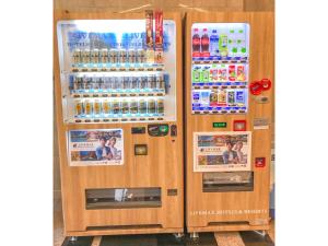 a vending machine filled with lots of drinks at HOTEL LiVEMAX BUDGET Fuji Ekimae in Fuji