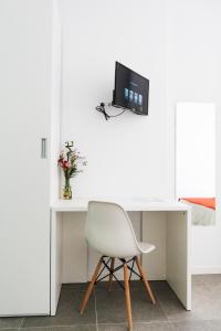 TV a/nebo společenská místnost v ubytování Hostal La Isla