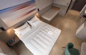 Postel nebo postele na pokoji v ubytování Olive Garden Hotel