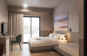 Postel nebo postele na pokoji v ubytování Olive Garden Hotel