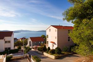 a row of houses in a town next to the water at Villa Bianca in Trogir