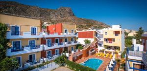 a view of a group of buildings with a swimming pool at Astra Village & Suites in Hersonissos