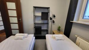 Łóżko lub łóżka w pokoju w obiekcie Apartament Skarbka