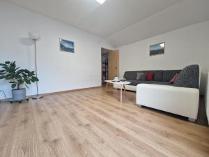 a living room with a couch and a table at Pension Bergfried in Hallstatt
