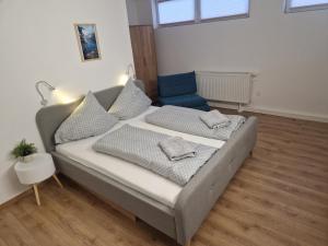 a bedroom with a bed with pillows on it at Pension Bergfried in Hallstatt