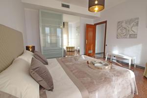 a bedroom with a bed with a bowl on it at Appartamento Dei Ronchi in Marina di Massa