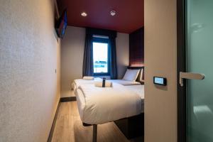 Letto o letti in una camera di easyHotel Dublin