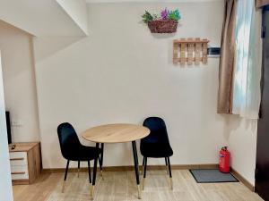 a table and two chairs in a room at Apartment N5 Old Tbilisi in Tbilisi City