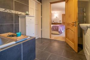 a bathroom with a counter and a sink in a room at Heron House in Haverigg