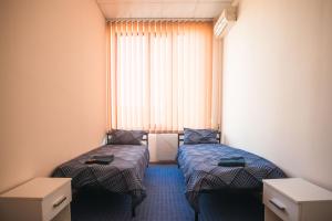 Ліжко або ліжка в номері Si-Yo hostel