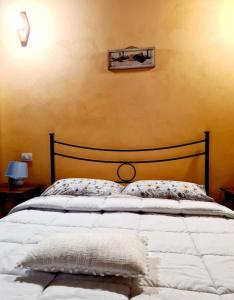 Postel nebo postele na pokoji v ubytování Agriturismo Le Grotte